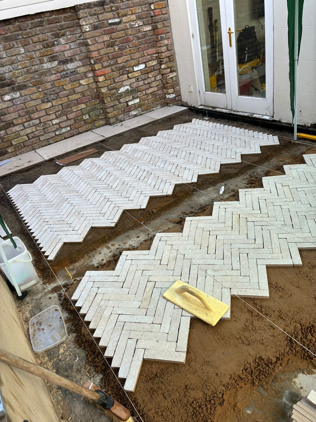 Herringbone fields dry-laid and string-lined during setting out