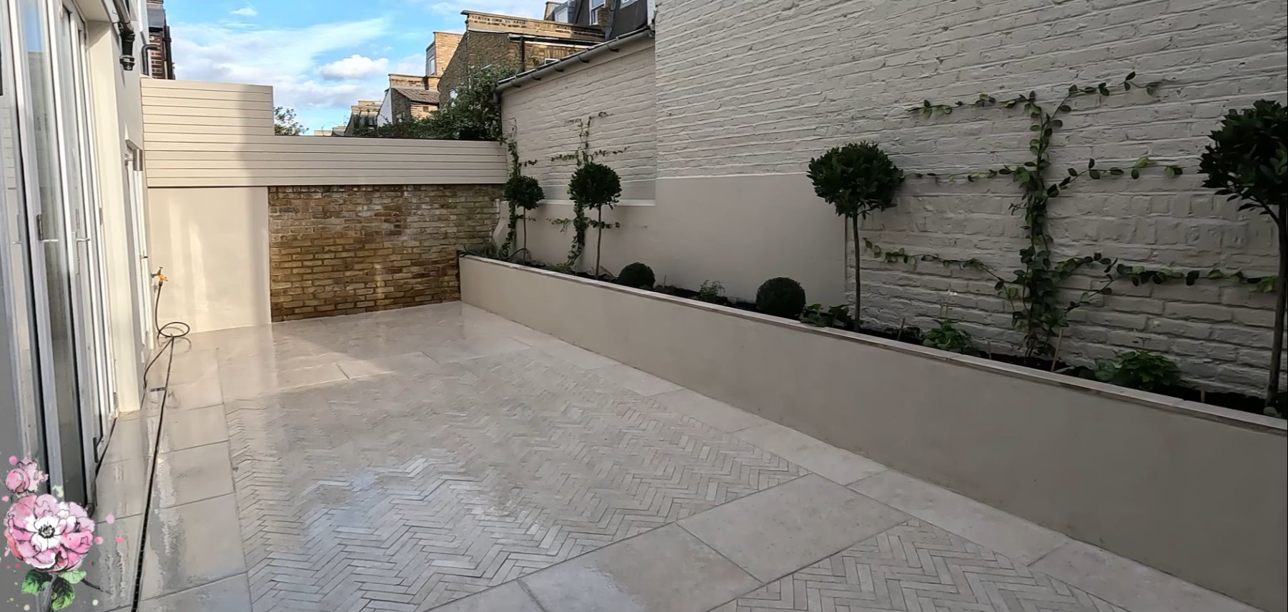 Finished herringbone and porcelain courtyard with rendered raised planters — Fulham